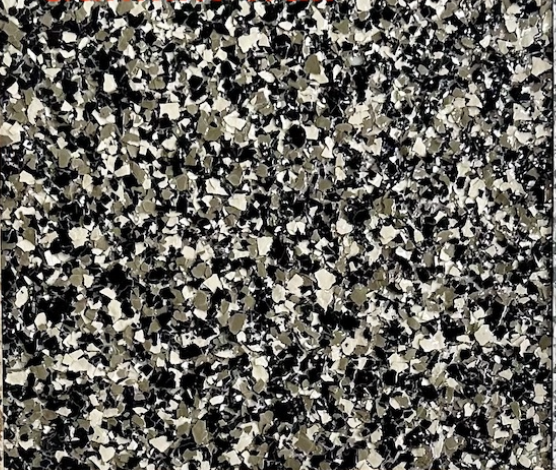 Gunflint Trail epoxy flake floor color sample with black, charcoal, gray, and light stone-colored flakes.