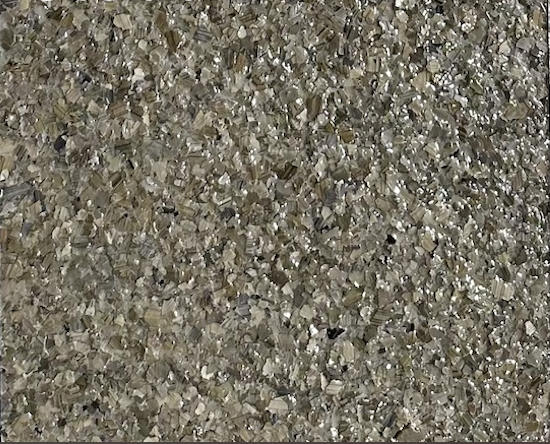 Obsidian epoxy flake floor color sample with dark gray, stone, cream, and black flakes.